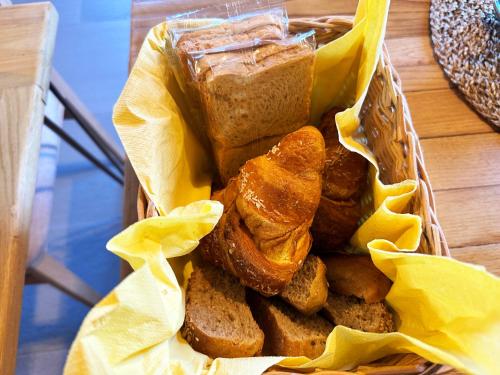 a basket of bread and other foods on a table at Oasi Acquafresca in Monzuno