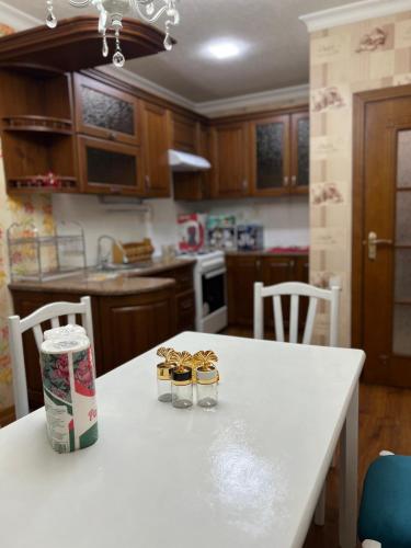 a kitchen with a table with two glasses on it at Elite comfort City house in Samarkand