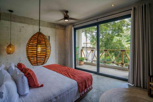a bedroom with a bed and a large window at Witari Hotel Boutique in San Francisco