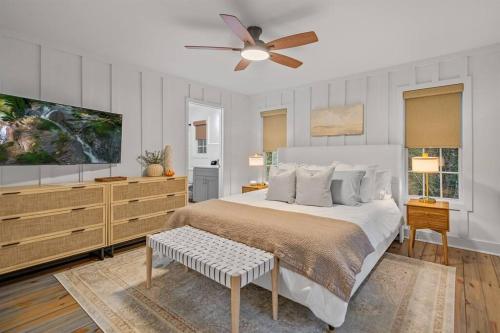 a bedroom with a bed and a ceiling fan at NEW White Pine Hideaway Fire pit Hot Tub Games in Ellijay