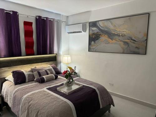Postel nebo postele na pokoji v ubytování Casa Mi Luz Ilumina tu Estancia con Elegancia y Confort en San Juan