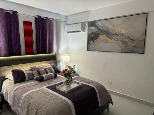 Postel nebo postele na pokoji v ubytování Casa Mi Luz Ilumina tu Estancia con Elegancia y Confort en San Juan