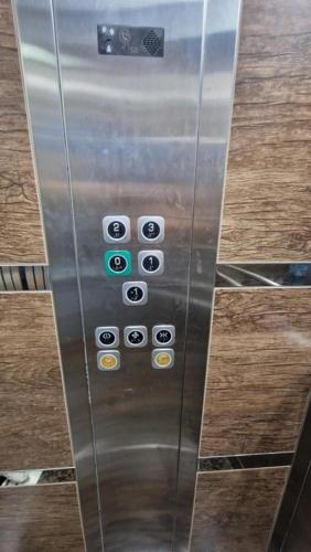 an elevator with a bunch of buttons on it at LUXURY APARTMAN ELENI ROOMS oaza mira i tišine u centru Vrnjačke banje in Vrnjačka Banja