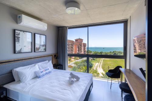 Cama o camas de una habitación en Spot Jurere sofisticación junto al mar - SPJ's