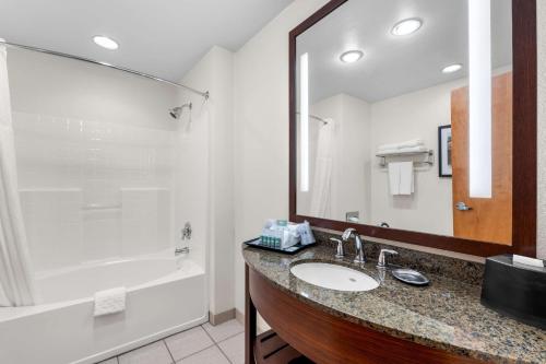 a bathroom with a sink and a shower at Best Western Rocky Mountain Lodge in Whitefish