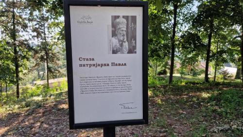 a sign in a park with a picture of a man at LUXURY APARTMAN ELENI ROOMS oaza mira i tišine u centru Vrnjačke banje in Vrnjačka Banja