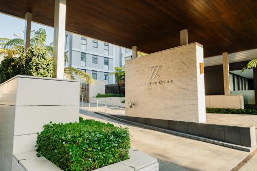 a building with a sign for the center of a city at Pavilions Marina Apartment 104 - Wynyard Quarter Viaduct Harbour in Auckland