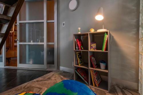 a room with a book shelf with books at Skyline Villa Indoor Pool Hot Tub in Millard