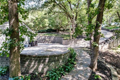 a park with trees and a stone wall at Skyline Villa Indoor Pool Hot Tub in Millard