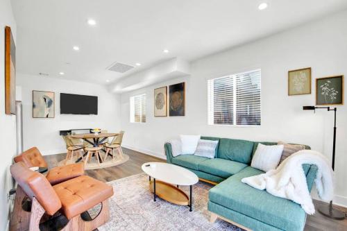 a living room with a couch and a table at Fresh & New Downtown LA Condo! in Los Angeles