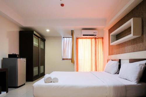 Katil atau katil-katil dalam bilik di Cozy and Homey Studio Apartment at High Point Serviced By Travelio