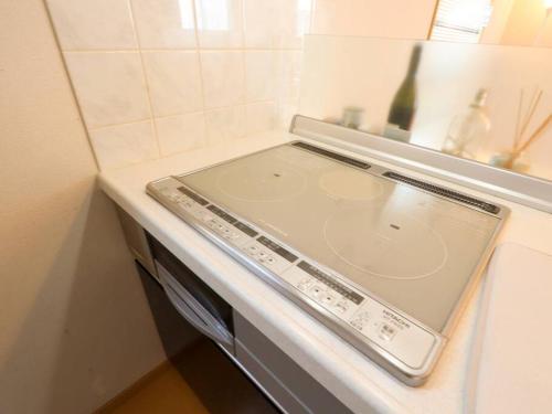 a dishwasher in a kitchen with a sink at 湯河原 Hama no ie in Yugawara
