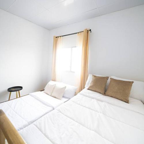 Ein Bett oder Betten in einem Zimmer der Unterkunft Casa en Ayangue, Ecuador