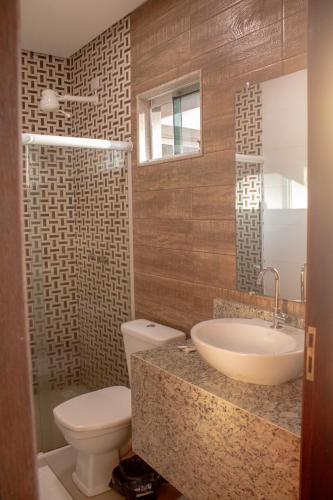 a bathroom with a sink and a toilet at Bara's Hotel in Bom Conselho