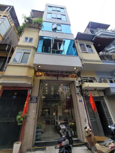 a building with a store in front of it at Hanoi Old Town in Hanoi