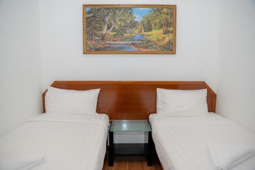 Postel nebo postele na pokoji v ubytování Ong Hotel