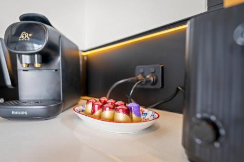 a bowl of candy in front of a computer at The Outlook on Mount Louis - Stunning Views in Tinderbox