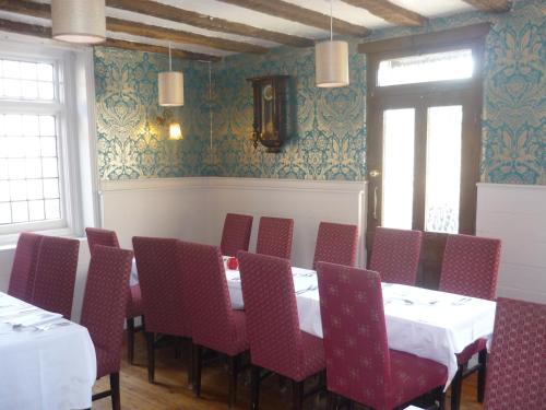
a room filled with tables and chairs at The Darnley Arms in Gravesend
