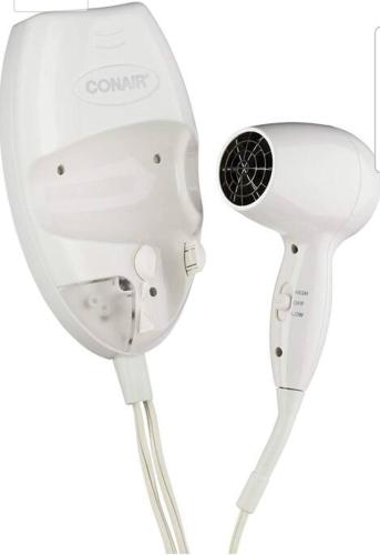 a white hairdryer on a white background at 2 Recamaras con clima y cocina centrico, wifi, tv smart in Ciudad Valles