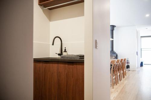 a kitchen with a sink and a counter at Banjo Treehouse in Hepburn Springs