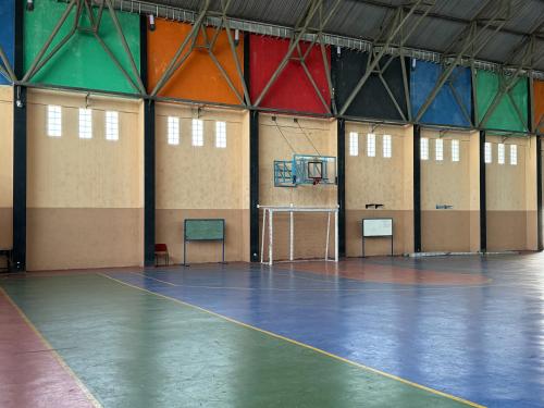 a large gymnasium with a basketball court in it at RedDoorz at Politeknik Pelayaran Surabaya in Surabaya