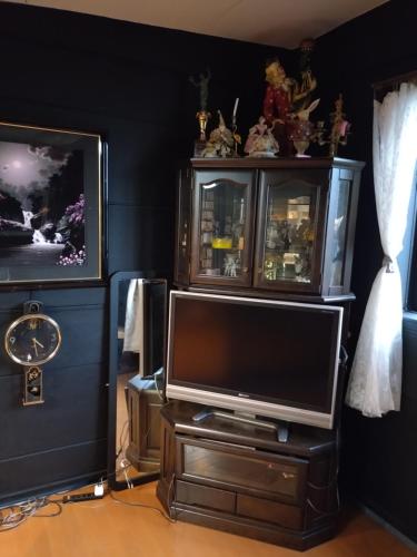 a living room with a television on a stand at Stage YOU in Tokyo