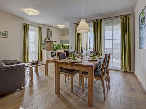 a kitchen and dining room with a table and chairs at Apartment in St Stefan im Rosental in Gigging