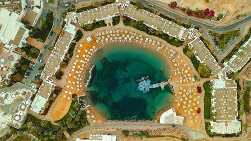 an aerial view of a pool of water in a parking lot at Domina Coral Bay Resort, Diving , Spa & Casino in Sharm El Sheikh