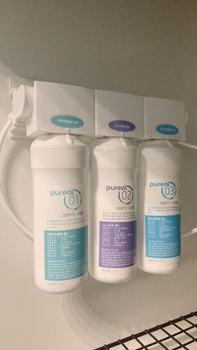 four containers of bleach are on a shelf in a refrigerator at Mango House5-High floor I Biggest unit I Sea view l Mountain view I Waterfilter I Wifi-JQ in Kota Kinabalu