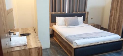 Postel nebo postele na pokoji v ubytování Tanger Tower