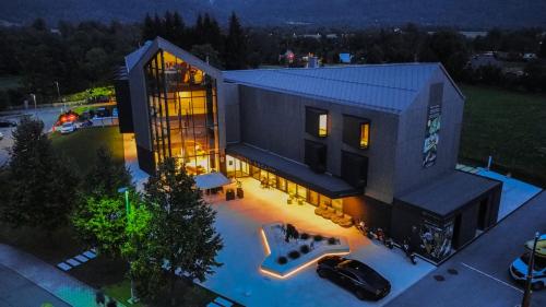 an overhead view of a house with a car in front at Hotel Soča in Bovec