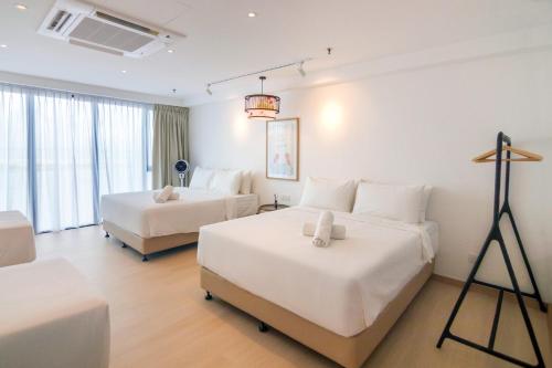a hotel room with two beds and a camera at Sunrise Gurney in George Town