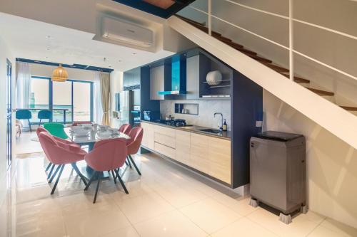a kitchen and dining room with a table and chairs at Sunrise Gurney in George Town