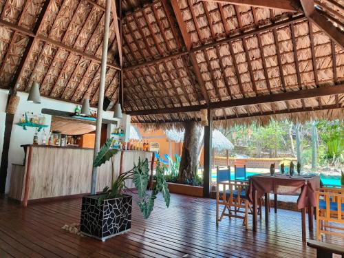 a dining area of a resort with a table and chairs at Suarez Hotel in Diego Suarez