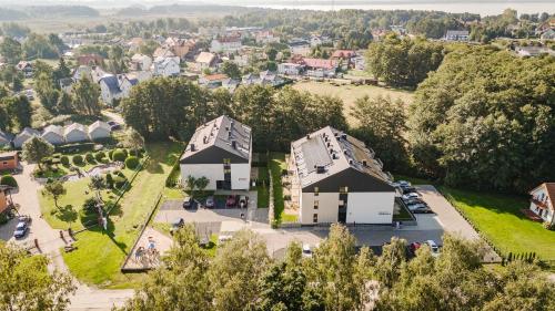 an aerial view of a house and a town at Kamienica Parkowa in Dąbki