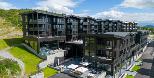 an aerial view of an apartment building at Riddergaarden Mountain Lodge, Beitostølen in Beitostøl