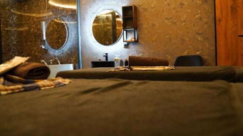 a room with two beds and a mirror on the wall at Cip Hotel & Spa - İstanbul Bakırköy City Center in Istanbul