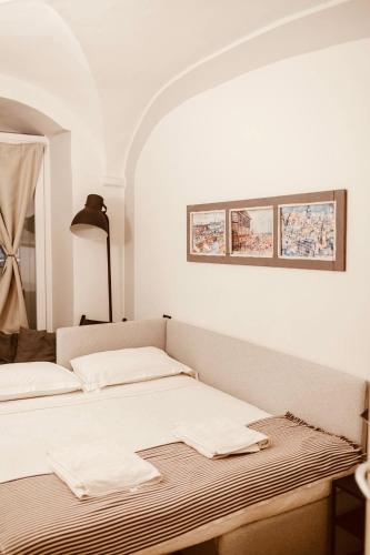 Postel nebo postele na pokoji v ubytování New Apartament in historical Genoa center