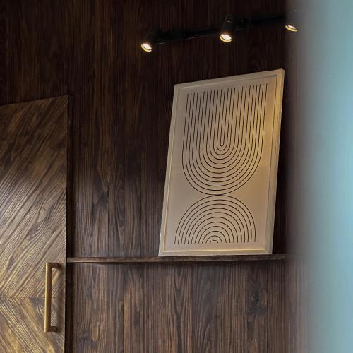a painting of a spiral on a wall at L'amour Stay Dalat in Xuan An