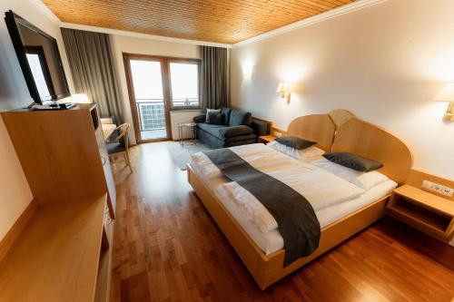 Postel nebo postele na pokoji v ubytování Aparthotel Pfeffermühle