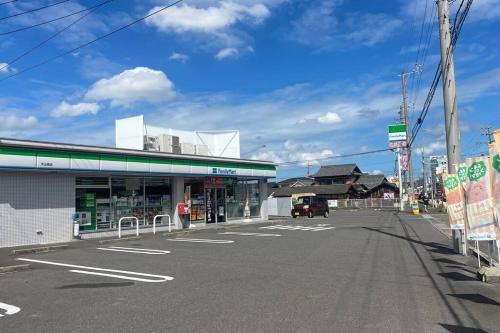 an empty parking lot in front of a store at 犬山1棟貸切り-guest house SAKURA in Inuyama
