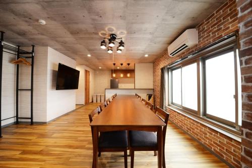 a conference room with a long table and chairs at Shinjuku NY House 301 in Tokyo