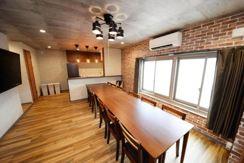 a conference room with a long table and chairs at Shinjuku NY House 301 in Tokyo