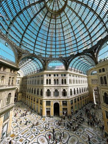 a large building with a glass domed ceiling at Caruso Place Boutique & Wellness Suites in Naples