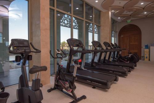 a row of exercise bikes in a gym at Golden Tulip Zanzibar Airport Hotel & Spa in Zanzibar City