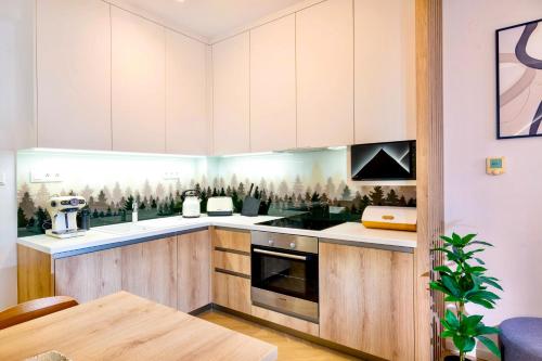 Kuchyň nebo kuchyňský kout v ubytování TATRYSTAY Cactus Luxury Apartments High Tatras