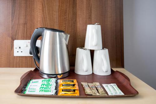 a coffee pot sitting on top of a tray at Royal National Hotel in London