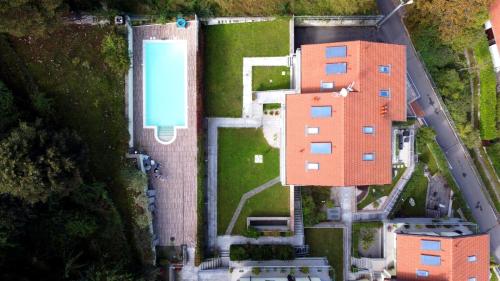 an overhead view of some buildings in a yard at Vista Dolce Isola _ Lakeview Pool, Terrace & Garden apartment in Argegno