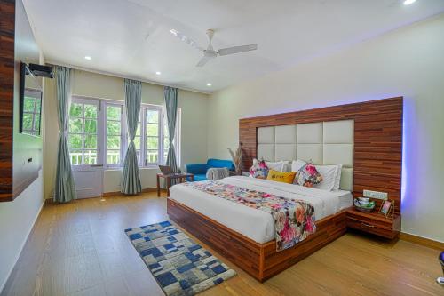 a bedroom with a large bed in a room at Pax Hotel Rock Villa Swimming Pool Available Dalhousie in Dalhousie