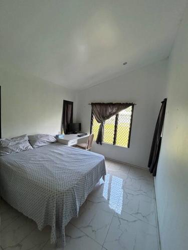 Postel nebo postele na pokoji v ubytování Langimanamonu